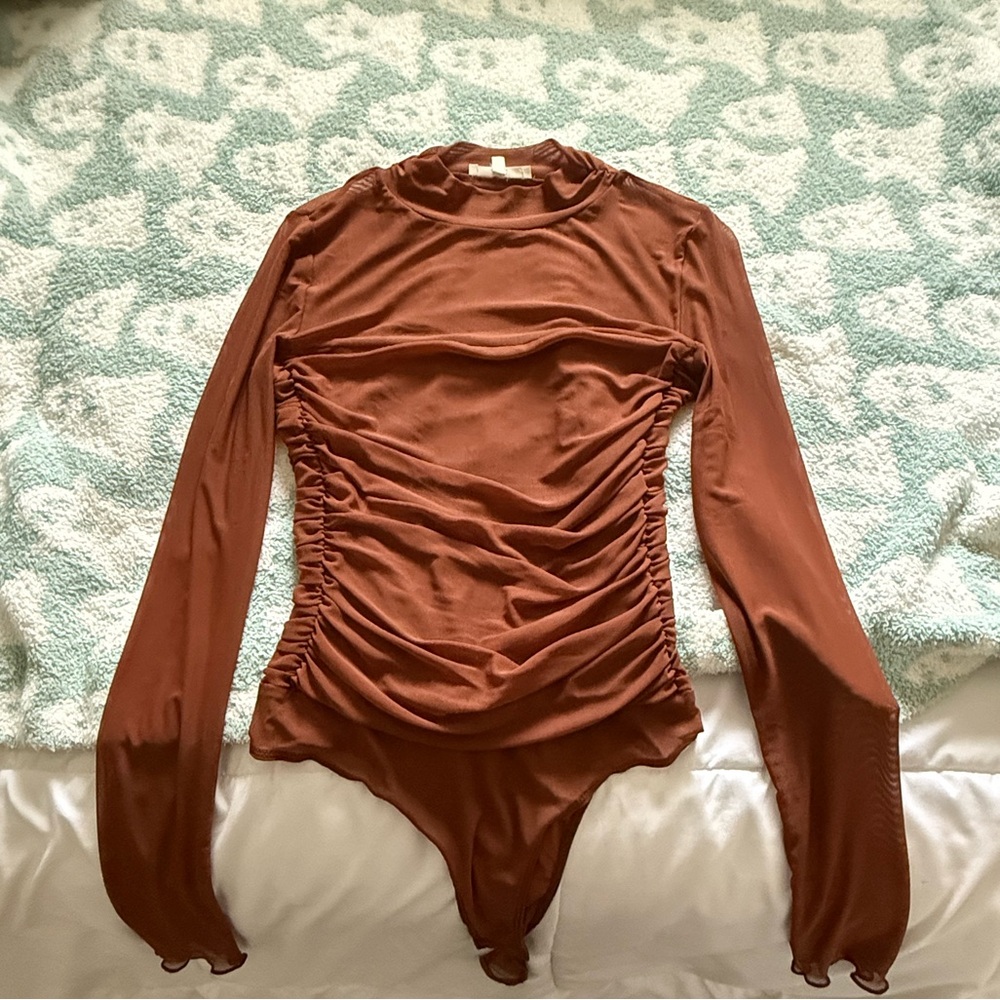 Camel brown mesh body suit
Never worn!!